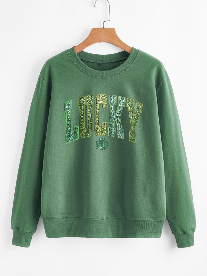 Dame uformell sweatshirt med glitrende skrift og firkløvermotiv Skjora