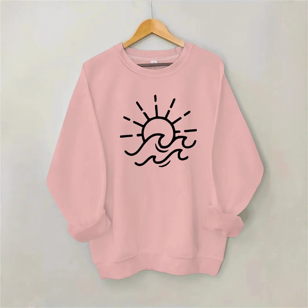 Dame sweatshirt med kreativ sol- og bølgedesign Skjora