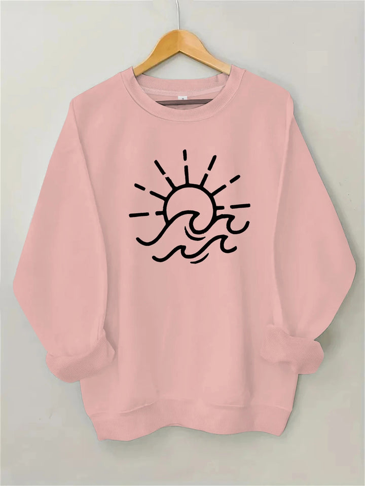 Dame sweatshirt med kreativ sol- og bølgedesign Skjora