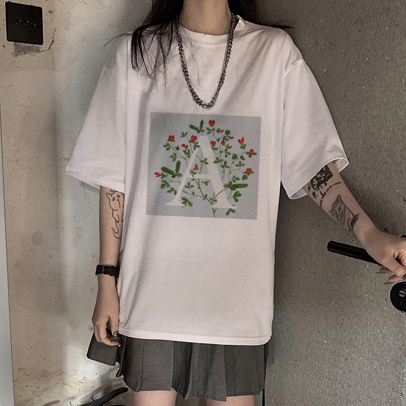 Dame T-skjorte med blomsterdesign og kreativt trykk Skjora