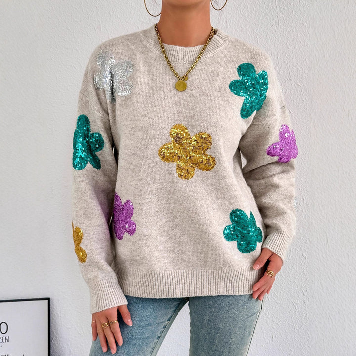 Kvinnes glitrende oversized genser med blomstermotiv Skjora