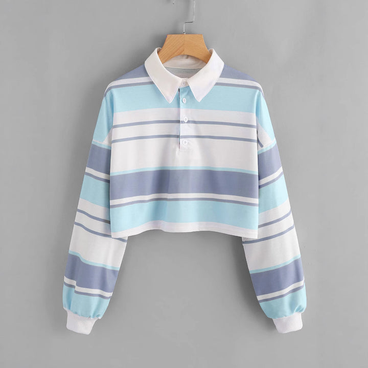 Dame polo skjorte i en avslappet crop design med et stilfullt fargeblokk mønster Skjora