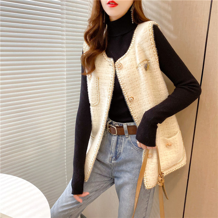 Kvinnes elegant cardigan med dekorative knapper og stillegant design Skjora