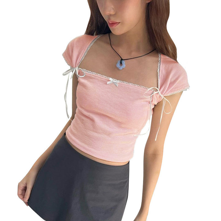 Dame Crop-top med justerbare spaghetti-stropper og elegante knute-detaljer Skjora