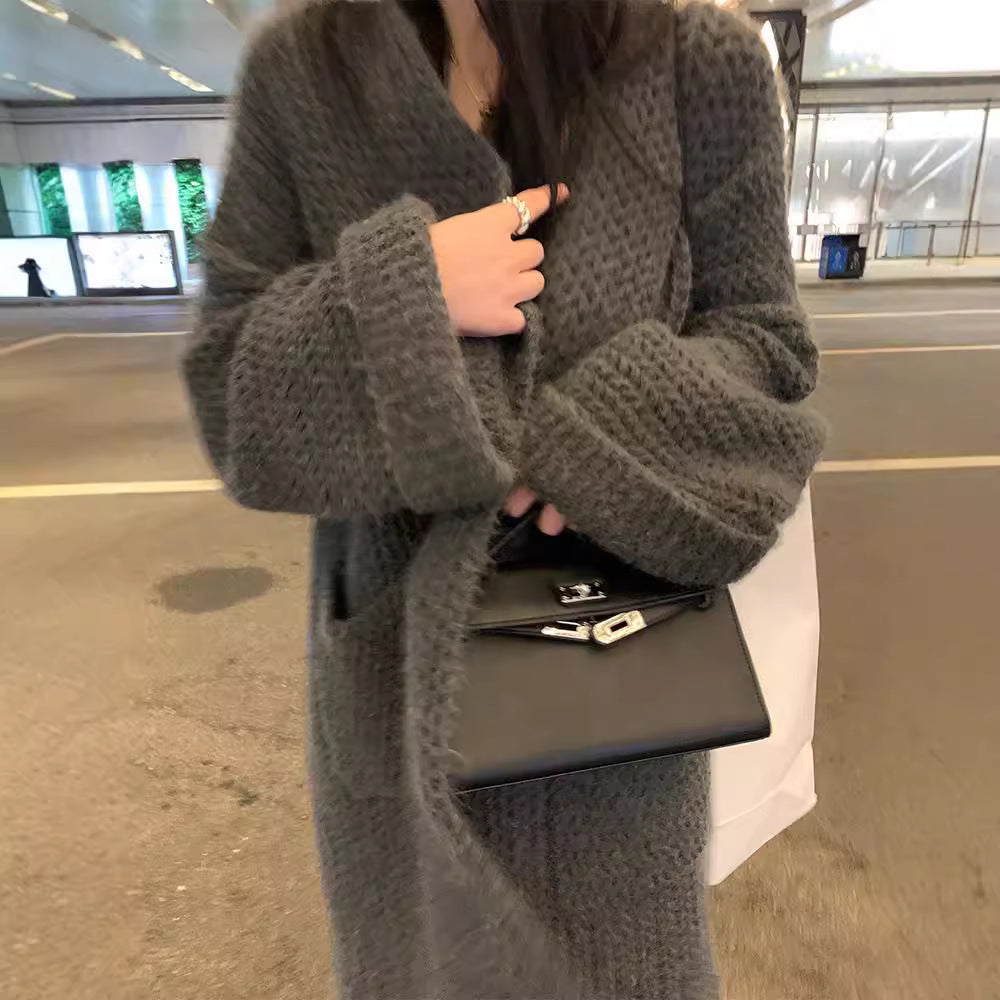 Kvinnens chunky strikket cardigan med åpne lommer og avslappet passform Skjora