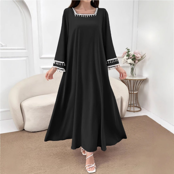 Kvinne Elegant Maxi Kjole med Dekorative Frynser og Brede Ermer Skjora