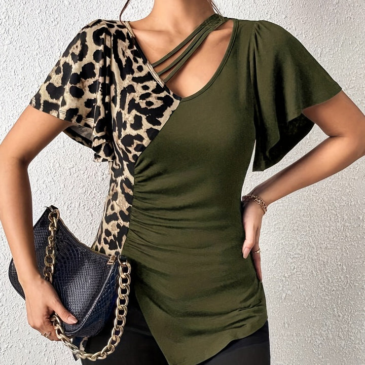 Dame Trendy topp med asymmetrisk design og raffinerte cut-outs Skjora