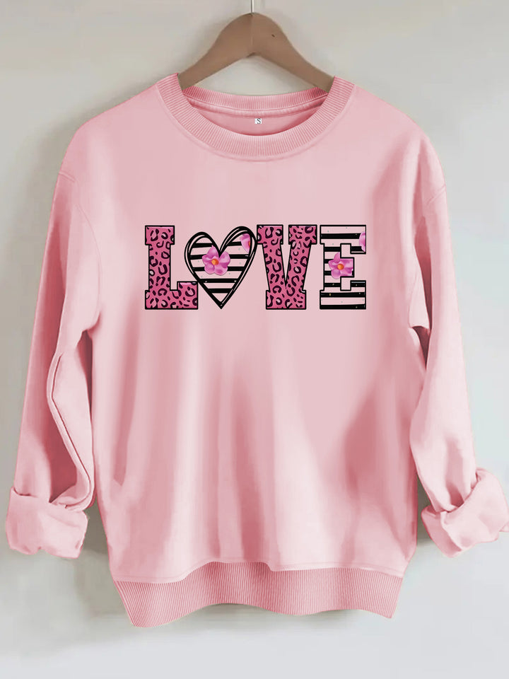 Dame sweatshirt med moderne leopard hjerte-design og behagelig passform Skjora