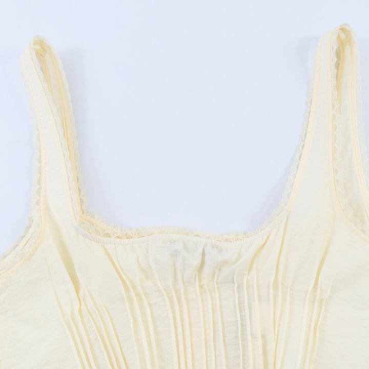 Dame-Crop-Top med fine folder og pynteknapper Skjora