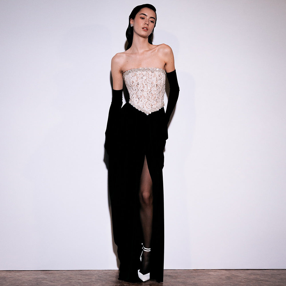 Women's elegant evening dress with glittery pointed top and draped skirt