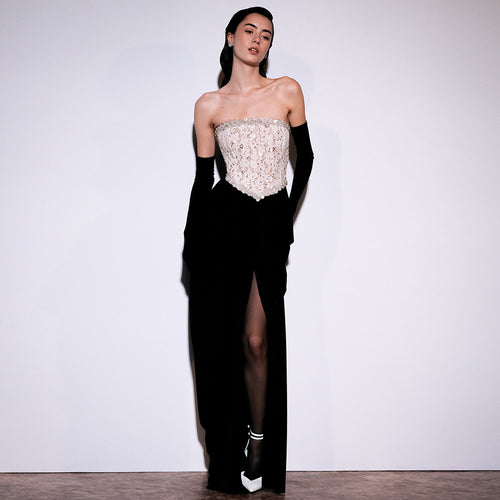 Women's elegant evening dress with glittery pointed top and draped skirt