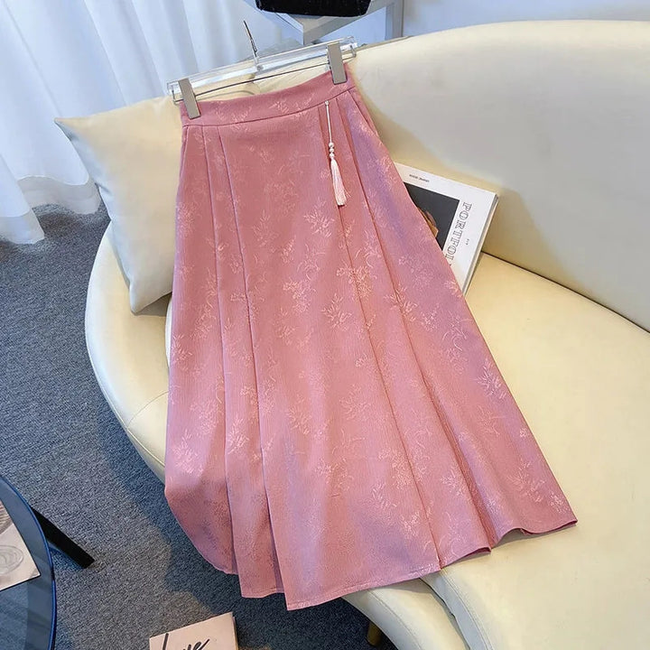 Damenes elegante midi skjørt med teksturert stoff og flytende snitt