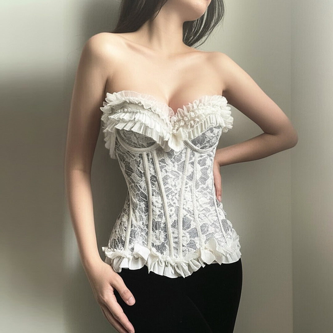 Dame spiss-bustier med volangdetaljer og sløyfer Skjora
