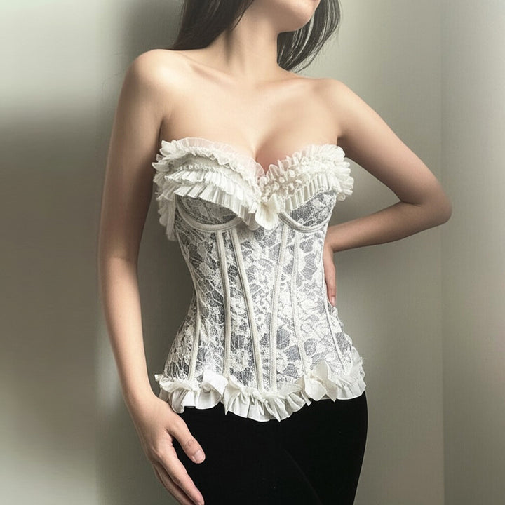 Dame spiss-bustier med volangdetaljer og sløyfer Skjora