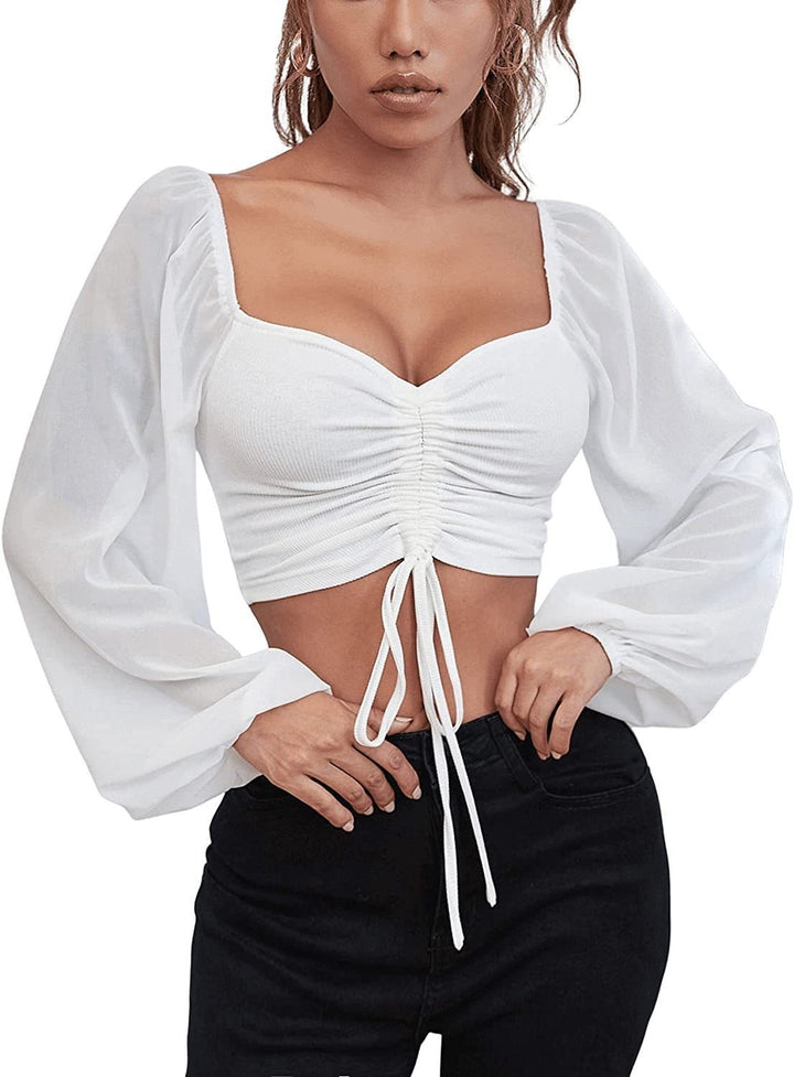 Dame Crop-Top med strukturert kropp og elegante pufferm. Skjora