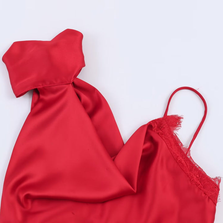 Damer elegant satintopp med asymmetrisk hem og spissdetaljer Skjora