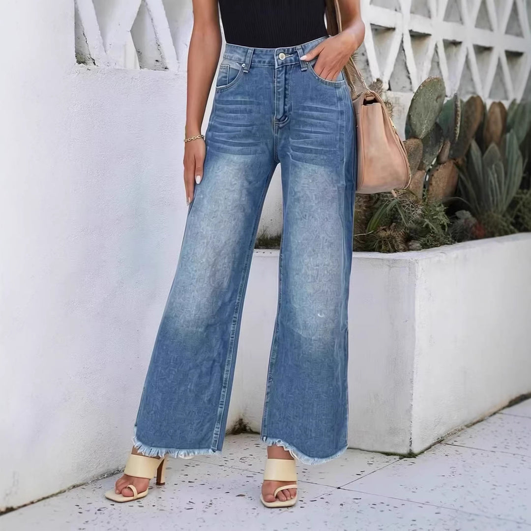 Dame vidde denim-jeans med kreativt mønster og frynset kant Skjora