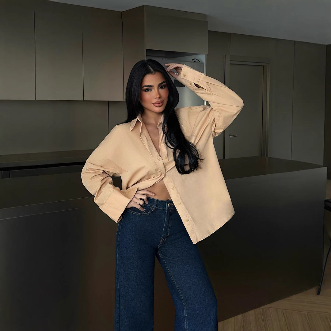 Damer elegant bluse med oversized snitt og knappbar design Skjora