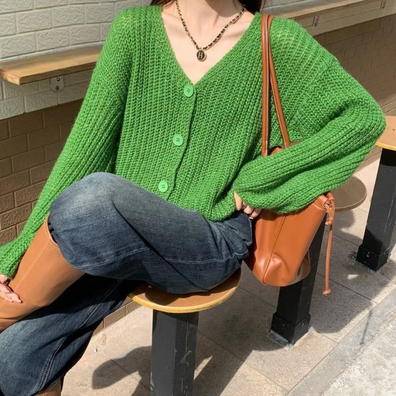 Dame cardigan med overdimensjonerte ermer og knappdetalj Skjora