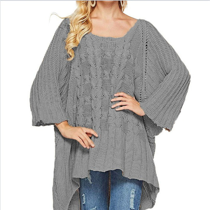 Kvinnes chunky strikket poncho med trendy kabelforløpning og brede ermer Skjora