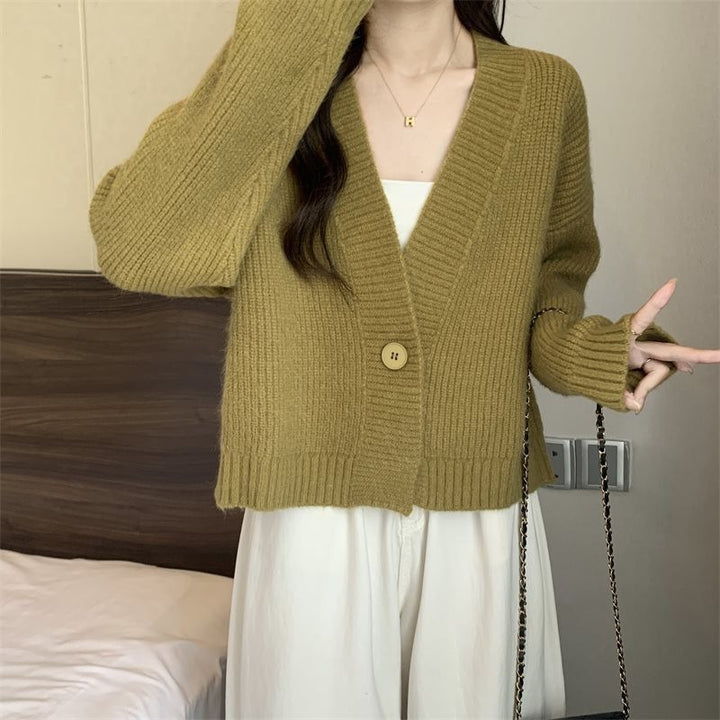 Kvinnenes løse cardigan med V-hals og store knapper Skjora