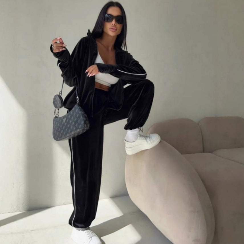 Kvinne elegant fleece treningsdrakt med praktiske lommer og elastiske mansjetter