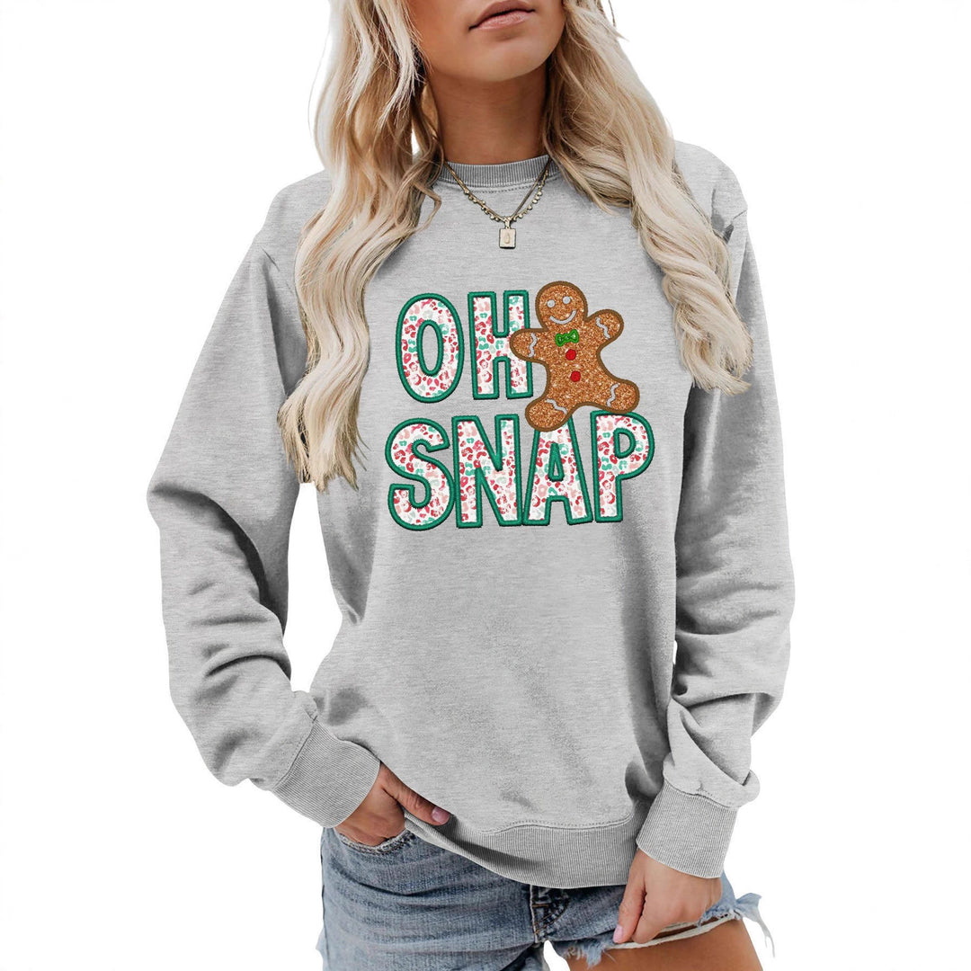 Dame sweatshirt med morsomt pepperkakemannmotiv og glitrende bokstaver Skjora