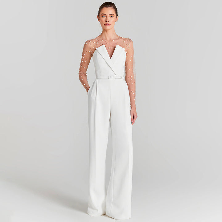 Damer elegant jumpsuit med transparente ermer og perlepynt Skjora