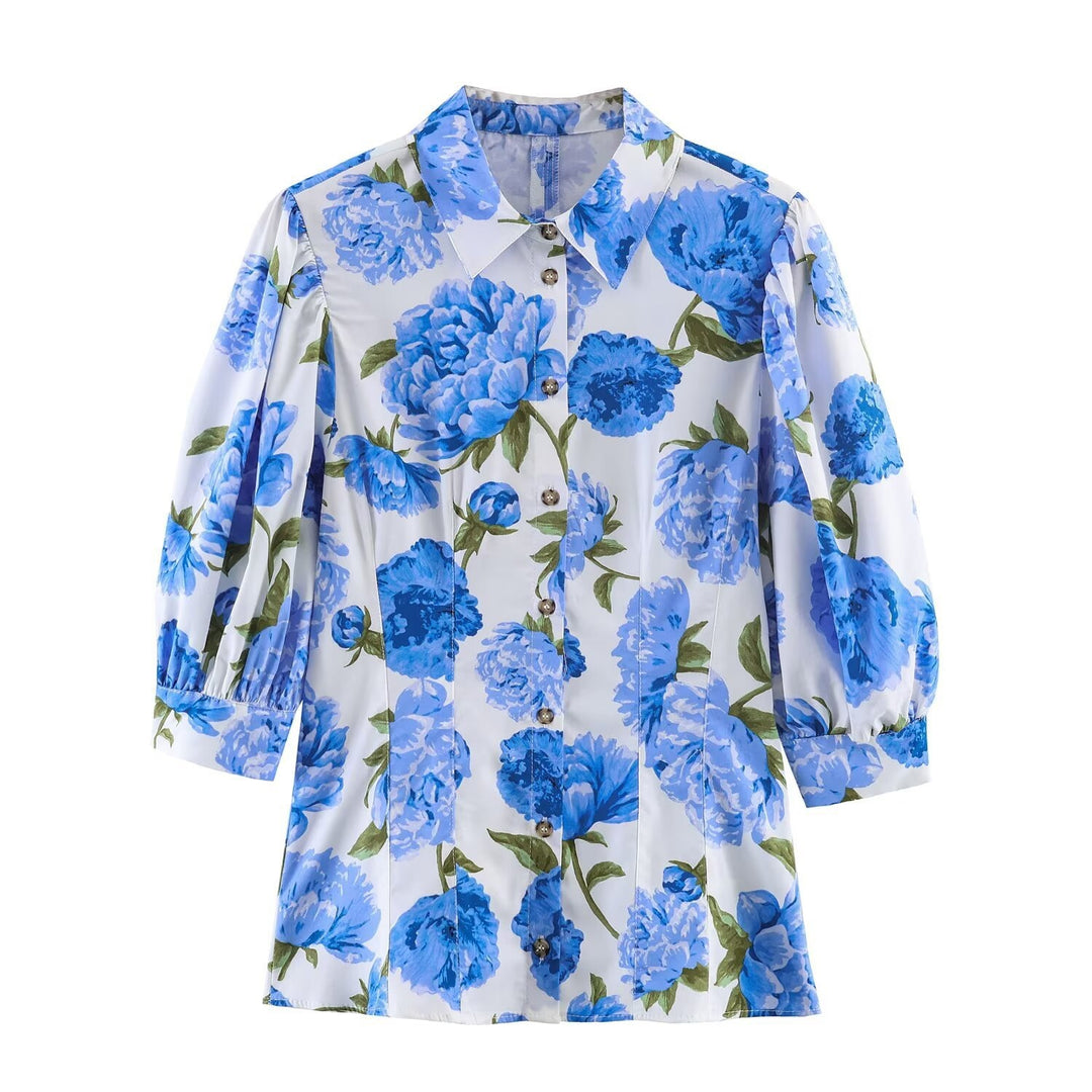 Damebluse med blomsterdesign og elegante puffermedeer Skjora