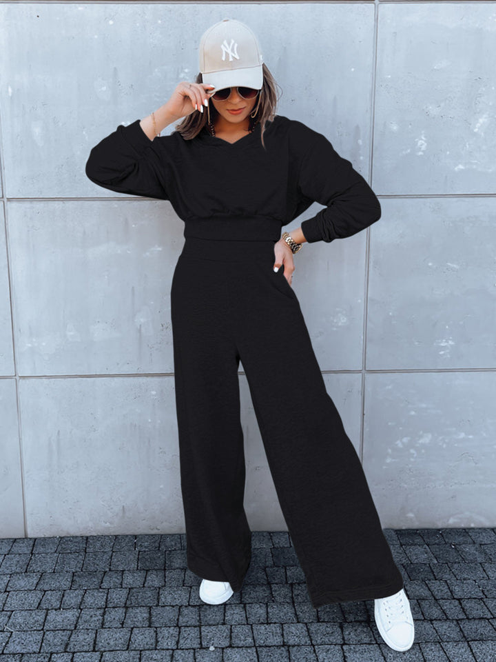 Kvinne casual jumpsuit med vide ben og praktisk hette Skjora