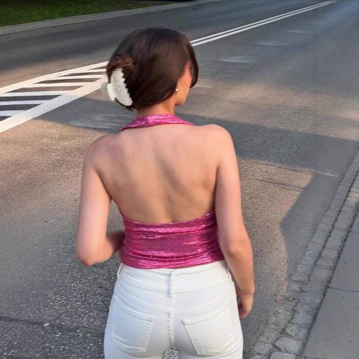 Dame ryggløs topp med dyp V-hals og raffinerte volangdetaljer Skjora