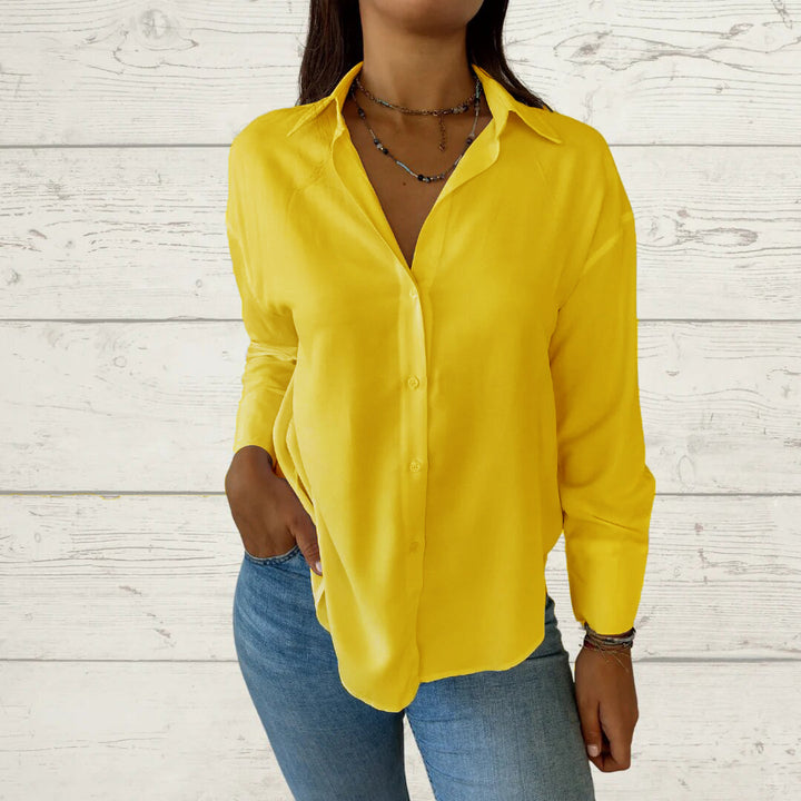 Dame elegant langermet bluse med fint stoff og feminine detaljer Skjora