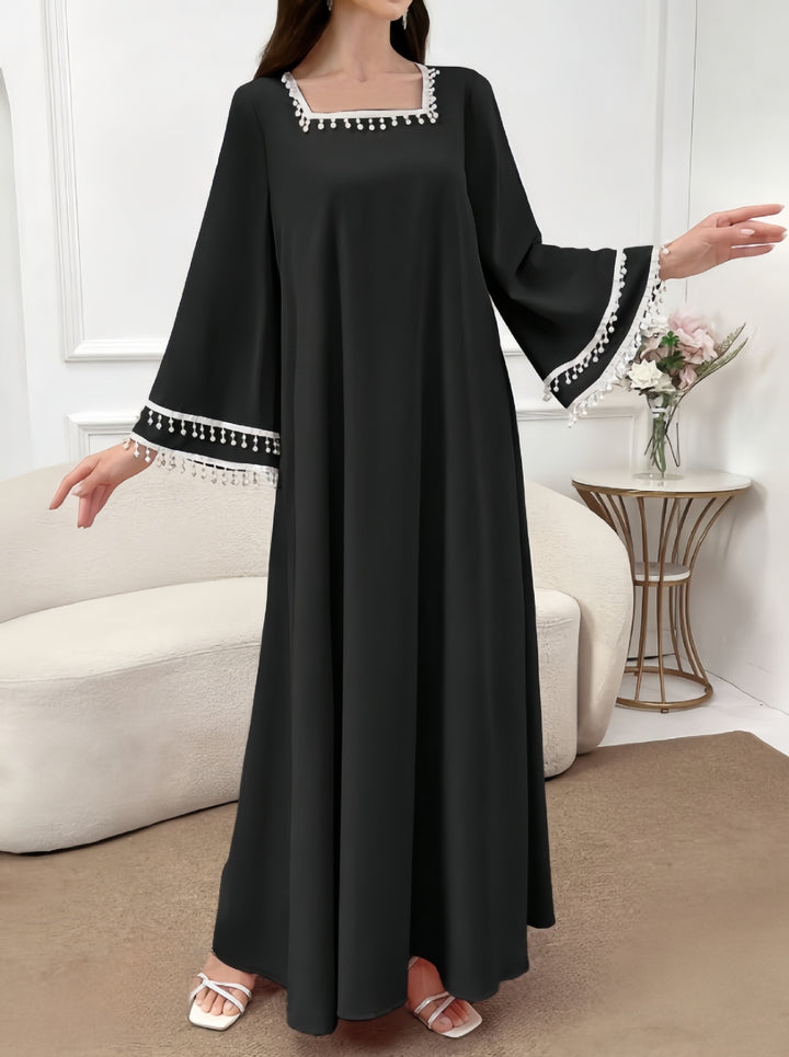 Kvinne Elegant Maxi Kjole med Dekorative Frynser og Brede Ermer Skjora