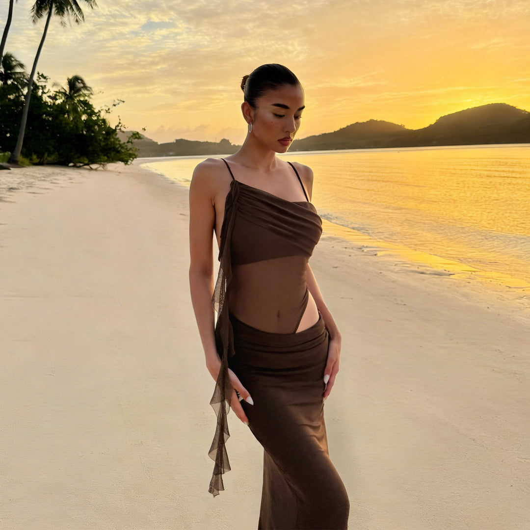 Elegant women's evening dress with refined ruffle details and transparent inserts Skjora
