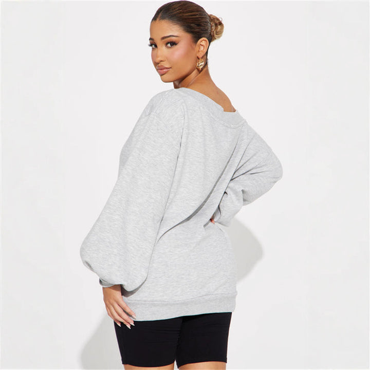 Kvinners oversized sweatshirt med asymmetrisk utringning og ballongformede ermer