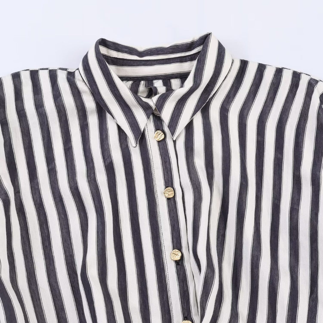 Dame jumpsuit med elegant stripemønster og dekorativt belte Skjora