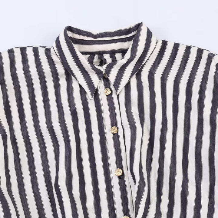 Dame jumpsuit med elegant stripemønster og dekorativt belte Skjora