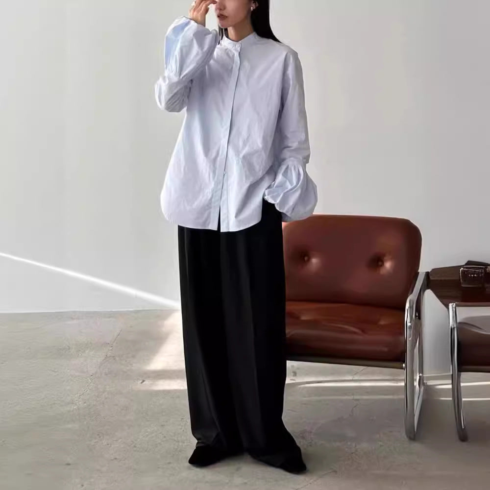 Dame Elegant bluse med voluminøse ermer og ståkrage Skjora