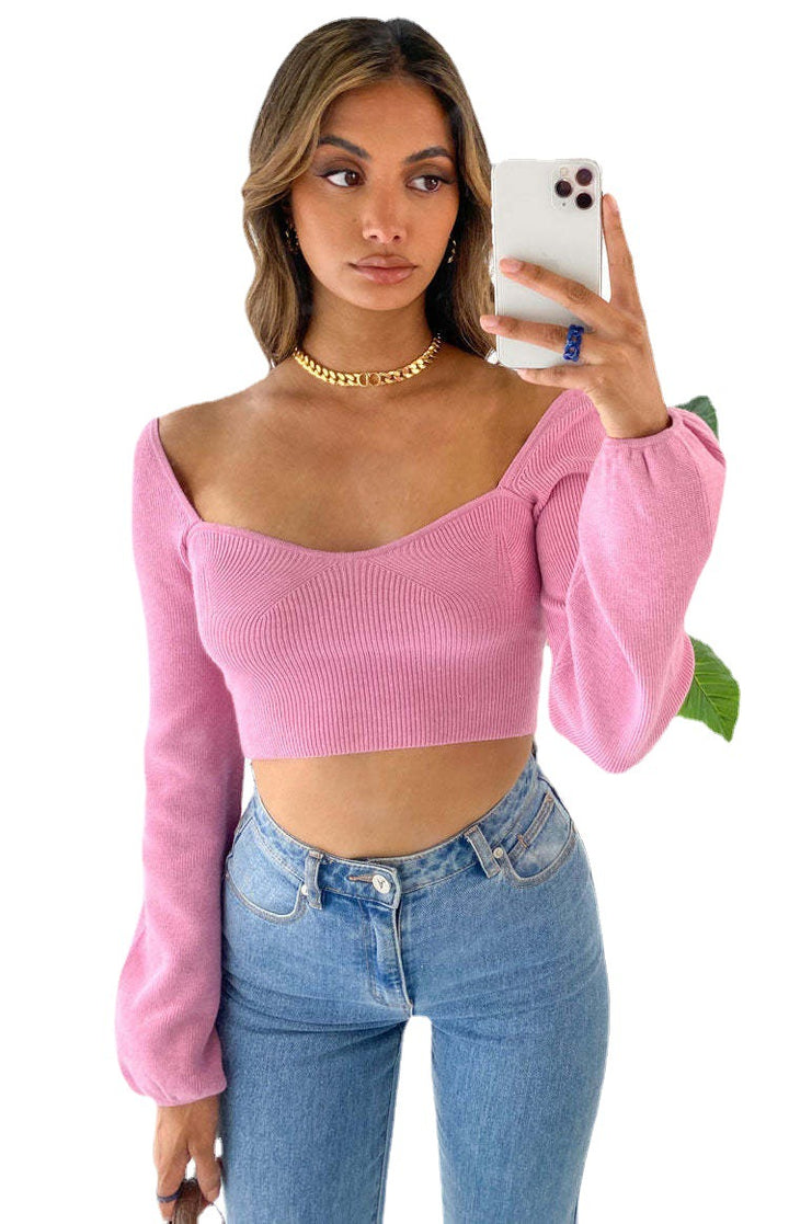 Damer elegant cropped topp med stilfull ribbestruktur og vid erme Skjora