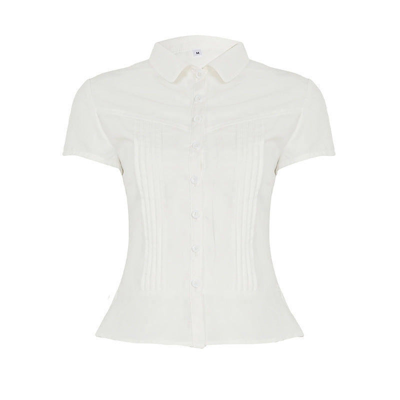 Damebluse med innsvingt snitt og dekorative folder Skjora