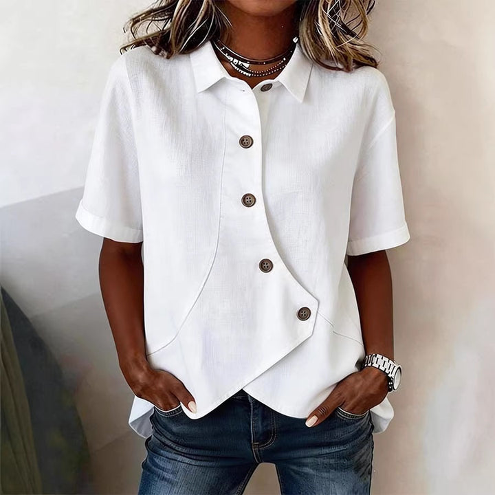 Dame spesielt designet bluse med unike knapppanel Skjora