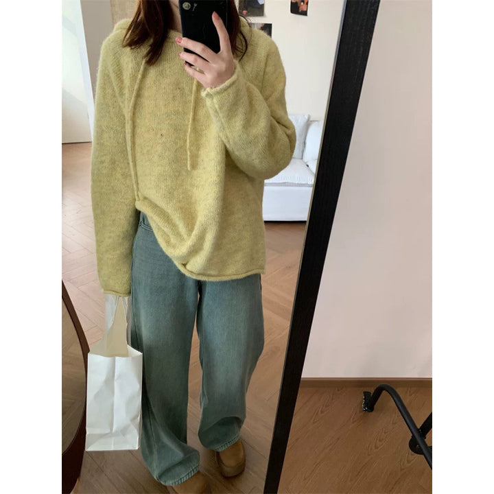 Dame koselig hettegenser laget av mykt fleece-materiale med kengurulomme Skjora