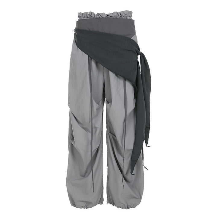 Dame modische High-Waist-bukse med asymmetrisk design og sidelivsnedbinding Skjora