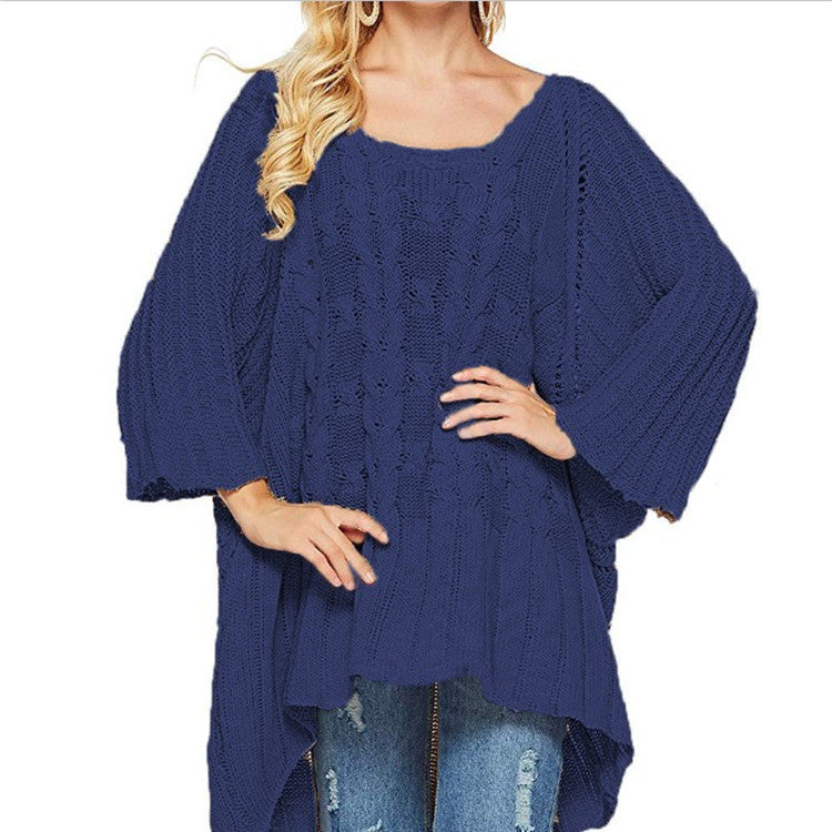 Kvinnes chunky strikket poncho med trendy kabelforløpning og brede ermer Skjora