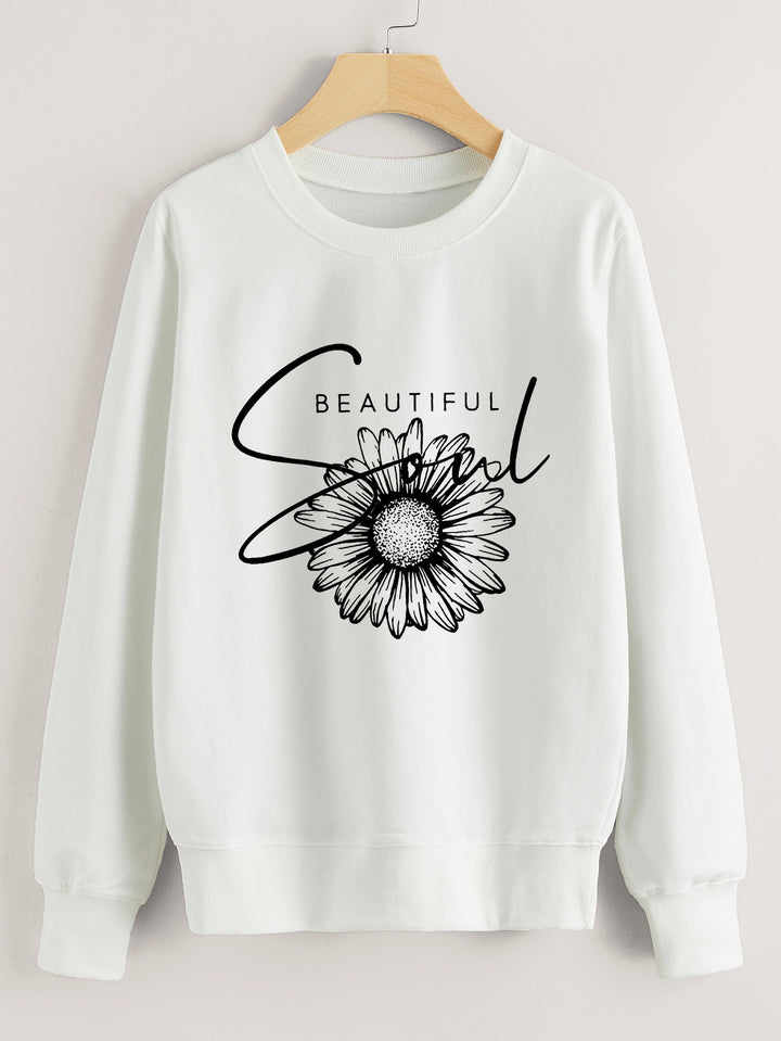 Dame genser med blomstermotiv og inspirerende tekst Skjora