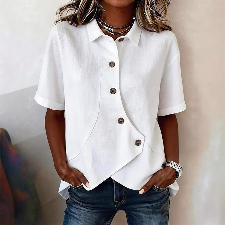 Dame spesielt designet bluse med unike knapppanel Skjora