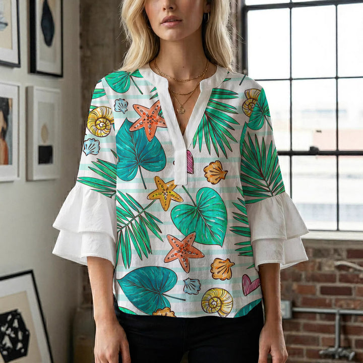 Dame bluse med voluminøse rysjermer og moderne motiv Skjora