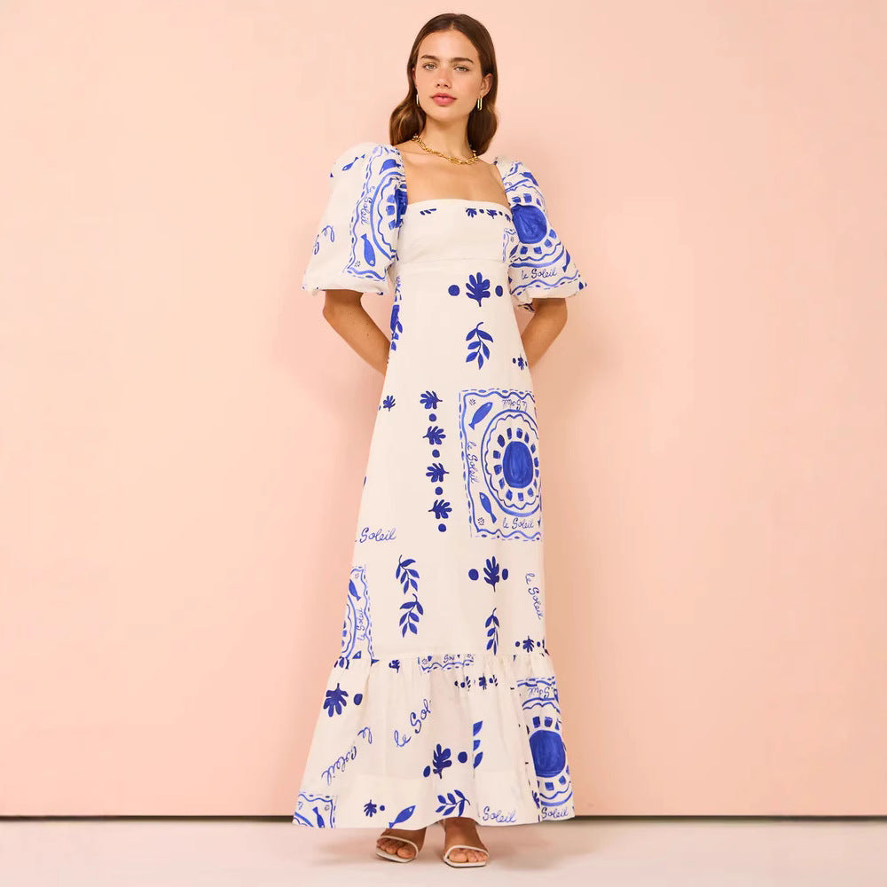 Dame maxi kjole med elegante pufferm og blomsterdetaljer Skjora