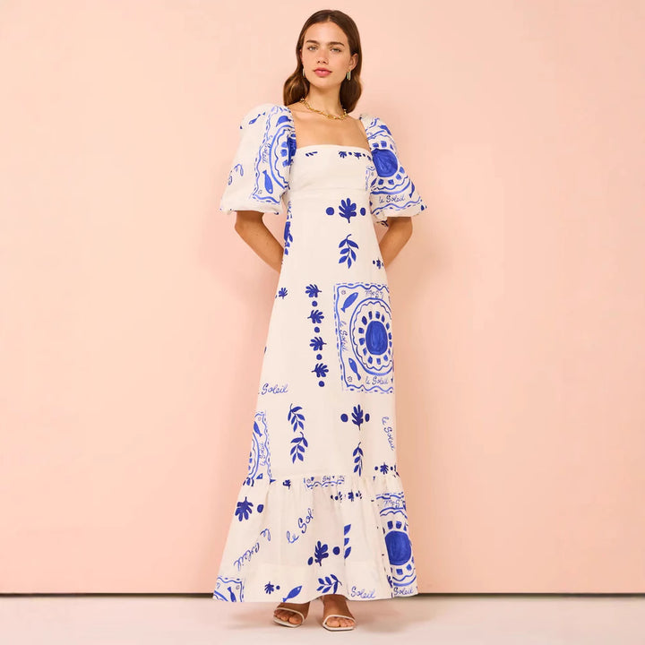 Dame maxi kjole med elegante pufferm og blomsterdetaljer Skjora