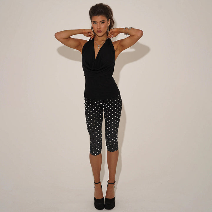 Dame figurtilpasset jumpsuit i prikket design Skjora
